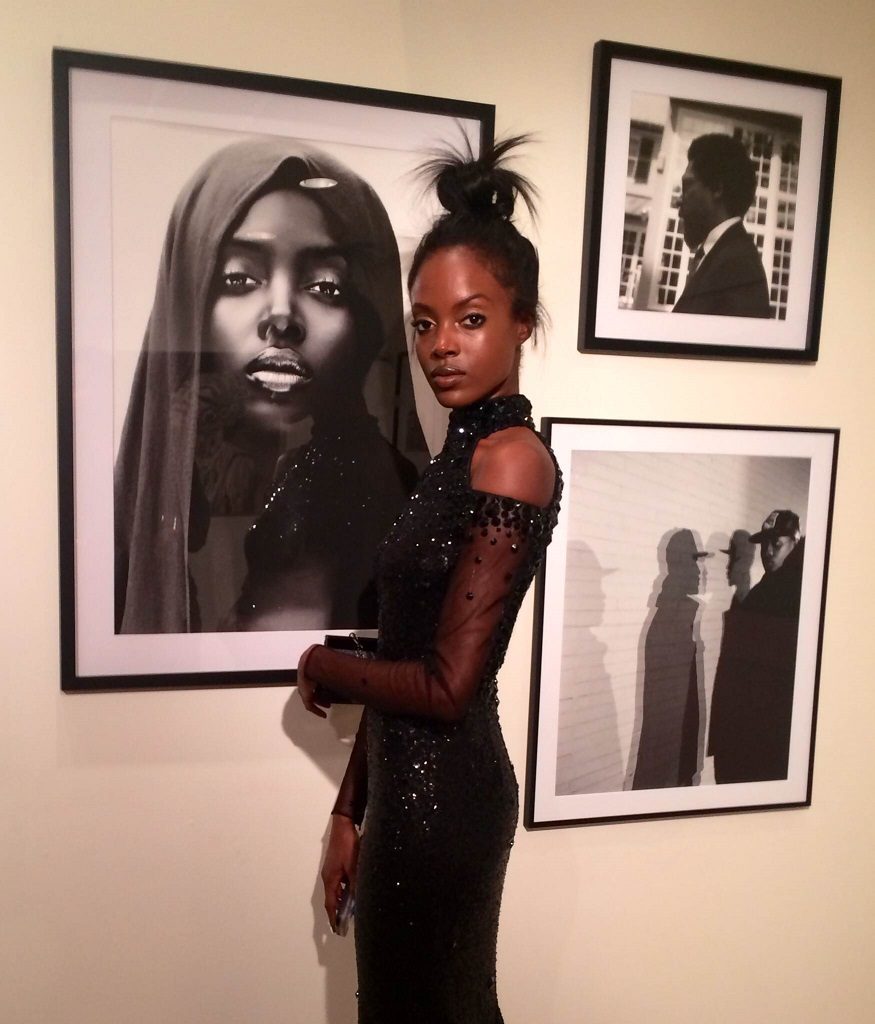 Model Madisin Rian next to a limited edition print of the viral image 'Black Madonna' a photo of herself by Andreea Radutoiu that even caused an international bidding war (photo by Joakim von Ditmar) 